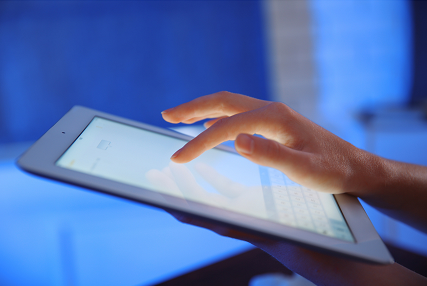 Hand using tablet